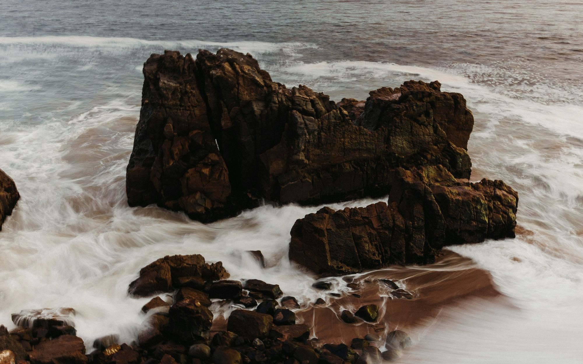 Waves washing around sea rocks at Point Mugu on the Ventura County coast